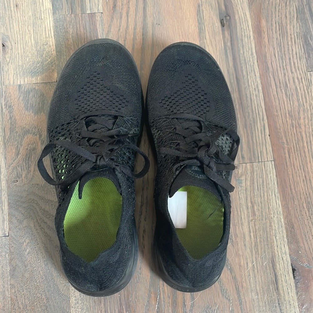 Womens black Nike free runs